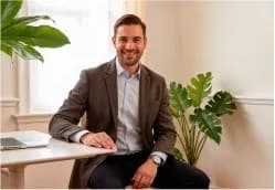 A consultant working at a desk in a Dubai office